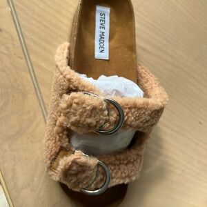 Steve Madden Comfy fleece lined Steve Madden slides. Never worn.